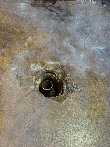 Failed cast-iron drain line cut out of the slab for replacement