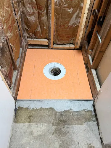 New custom sloped shower pan set with a bonded-flange drain