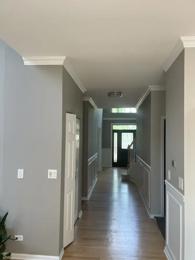 Kitchen after repaint with crown moulding and finished trim