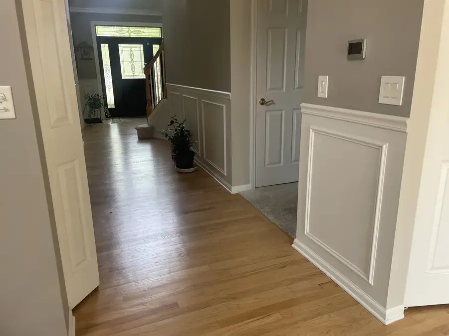 Entryway with wainscoting-style wall mouldings