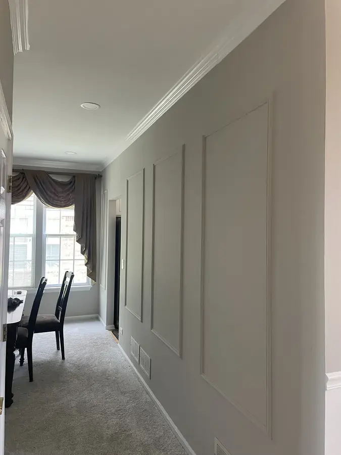 Wide shot of living room with completed trim work