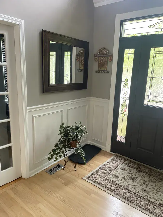 Overall view of first floor trim, mouldings, and repaint
